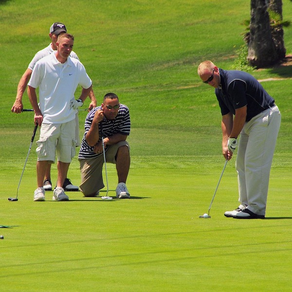 Golfers on golf green