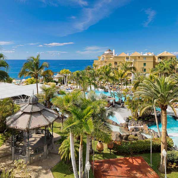 View of gardens, pools and sea from Jardines de Nivaria Hotel